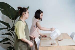 water filtration system family drinking clean glass of water