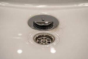 I need to find local companies offering drain cleaning services in Hutto, TX.