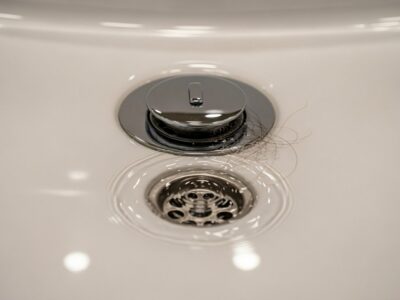 I need to find local companies offering drain cleaning services in Hutto, TX.